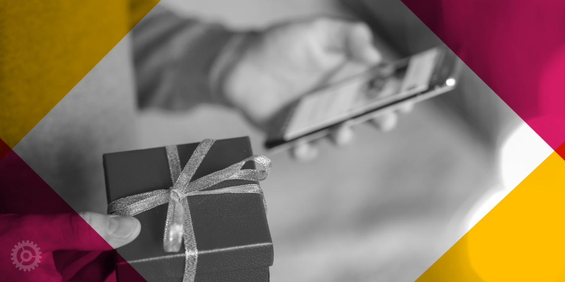 Man Holding Gift And Phone