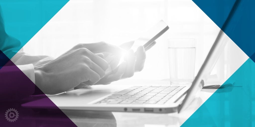 Man Using Phone And Laptop